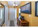 Bright foyer with tile flooring, white door, and an elegant wooden console table at 5982 Blue Heron Way, Plainfield, IN 46168