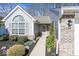 Close-up of the home's entrance, showcasing the landscaping and architectural details at 5982 Blue Heron Way, Plainfield, IN 46168