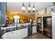 Spacious kitchen with granite countertops, tile backsplash, and modern appliances at 5982 Blue Heron Way, Plainfield, IN 46168