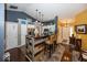 Kitchen and bar area with dark countertops, pendant lighting, and wood-look accents at 5982 Blue Heron Way, Plainfield, IN 46168