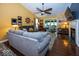 Comfortable living room featuring hardwood floors, vaulted ceilings, and a ceiling fan at 5982 Blue Heron Way, Plainfield, IN 46168