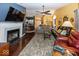 Open-concept living room featuring hardwood floors, a fireplace, and access to other rooms at 5982 Blue Heron Way, Plainfield, IN 46168