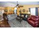 Spacious living room featuring hardwood floors, comfortable seating, and stylish decor at 5982 Blue Heron Way, Plainfield, IN 46168