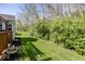 Lush side yard showcasing mature landscaping and manicured lawn at 5982 Blue Heron Way, Plainfield, IN 46168