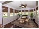 Bright sunroom with a vaulted ceiling, lots of windows, and hardwood floors at 5982 Blue Heron Way, Plainfield, IN 46168