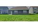 Spacious backyard with lush green lawn, perfect for outdoor activities and relaxation at 6118 Aspen Meadow Dr, Indianapolis, IN 46237