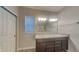 Bathroom featuring double vanity with granite countertops, large mirror, and modern fixtures at 6118 Aspen Meadow Dr, Indianapolis, IN 46237