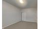 A carpeted bedroom with a closet, light, and neutral color scheme at 6118 Aspen Meadow Dr, Indianapolis, IN 46237