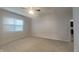 Bright and airy bedroom with plush carpet, ceiling fan, and large window at 6118 Aspen Meadow Dr, Indianapolis, IN 46237