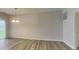 Open dining area with sliding glass door to yard and modern chandelier at 6118 Aspen Meadow Dr, Indianapolis, IN 46237