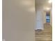 Bright hallway featuring wood-look flooring, white doors, and recessed lighting at 6118 Aspen Meadow Dr, Indianapolis, IN 46237