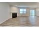 Spacious living room features luxury vinyl plank flooring and fireplace at 6118 Aspen Meadow Dr, Indianapolis, IN 46237