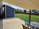 Backyard with sunshade covering the patio and a view of the large yard at 628 Williams Ct, Greenwood, IN 46142