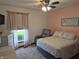 Bright bedroom featuring a bed, dresser, and a comfortable recliner chair at 628 Williams Ct, Greenwood, IN 46142