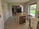 Dining area adjacent to the kitchen shows the open floor plan with access to the living room at 628 Williams Ct, Greenwood, IN 46142