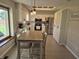 Bright kitchen boasts stainless appliances, white cabinetry, skylight, and eat-in dining area at 628 Williams Ct, Greenwood, IN 46142