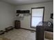 Spacious laundry room with modern appliances, storage, and pet feeding station at 628 Williams Ct, Greenwood, IN 46142