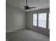 Bedroom with a ceiling fan, plush carpet, multiple windows for light and a neutral color palette at 6431 Furnas Rd, Indianapolis, IN 46221