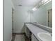 Bathroom featuring double sinks, vanity lighting and lots of vanity storage space at 6602 Cobden Ct, Indianapolis, IN 46254