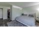 Spacious bedroom with a queen-sized bed, walk in closet, light walls and a cozy rug at 6602 Cobden Ct, Indianapolis, IN 46254