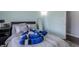 Comfortable bedroom with laminate wood flooring, a cozy bed, and natural light at 6602 Cobden Ct, Indianapolis, IN 46254