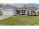Charming blue single-Gathering home with an attached garage and well-maintained lawn at 6602 Cobden Ct, Indianapolis, IN 46254