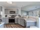 Updated kitchen with stainless steel appliances, marble countertops, modern cabinetry and hardwood floors at 6602 Cobden Ct, Indianapolis, IN 46254