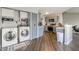 Open-concept laundry area with modern washer and dryer, and gray cabinets adjacent to updated kitchen at 6602 Cobden Ct, Indianapolis, IN 46254