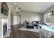 Spacious living room with vaulted ceiling, fireplace, barn doors, hardwood floors, and plentiful light at 6602 Cobden Ct, Indianapolis, IN 46254