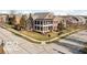 A stately brick home with a prominent two-story porch, nestled in a well-planned neighborhood at 6655 Westminster Dr, Zionsville, IN 46077
