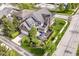 Aerial view of a home with a well-manicured yard and patio seating at 6655 Westminster Dr, Zionsville, IN 46077