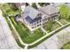 Beautiful aerial view of a home showcasing its manicured lawn and outdoor living space with patio set at 6655 Westminster Dr, Zionsville, IN 46077