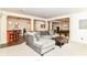 Spacious basement featuring plush carpeting, comfortable seating, and a stylish bar area at 6655 Westminster Dr, Zionsville, IN 46077