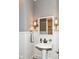 Charming powder room featuring stylish lighting fixtures and a pedestal sink at 6655 Westminster Dr, Zionsville, IN 46077