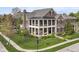 Impressive two-story brick home with a large front yard and a welcoming front porch at 6655 Westminster Dr, Zionsville, IN 46077