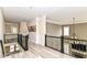 Bright hallway with hardwood floors and iron railings, showcasing the home's architectural details at 6655 Westminster Dr, Zionsville, IN 46077