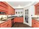 Functional kitchen with uniquely colored cabinets, stainless steel dishwasher, and ample counter space at 6655 Westminster Dr, Zionsville, IN 46077