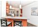 Stylish kitchenette with a breakfast bar, pendant lighting, and bright cabinetry at 6655 Westminster Dr, Zionsville, IN 46077