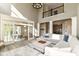 Bright living room featuring hardwood floors, high ceilings, and a cozy seating area with a sectional at 6655 Westminster Dr, Zionsville, IN 46077