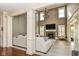 Open living room with soaring ceilings, fireplace, large windows and hardwood floors at 6655 Westminster Dr, Zionsville, IN 46077