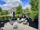 The backyard has a stone patio with lounge chairs and outdoor seating, perfect for entertaining at 6655 Westminster Dr, Zionsville, IN 46077