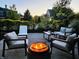 Cozy outdoor patio with a fire pit and comfortable seating, ideal for relaxing evenings at 6655 Westminster Dr, Zionsville, IN 46077