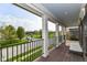 Inviting porch with views of the neighborhood, complete with pillars and comfortable seating at 6655 Westminster Dr, Zionsville, IN 46077