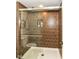 Modern shower with tiled walls, glass door, and built-in shelving niche at 6655 Westminster Dr, Zionsville, IN 46077