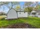Spacious backyard with a storage shed and green grass at 733 S Holmes Ave, Indianapolis, IN 46221