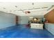 Spacious garage with ample storage, and painted flooring; ideal for vehicles and projects at 7901 Oaklandon Rd, Indianapolis, IN 46236