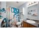 Bathroom with a marine theme, featuring a unique shower curtain and blue accents at 8211 Firefly Way, Indianapolis, IN 46259