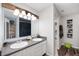 Bathroom with a double vanity, large mirror and a walk-in closet at 8211 Firefly Way, Indianapolis, IN 46259