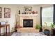 Close up of the living room fireplace with mantel and hearth, flanked by windows at 8211 Firefly Way, Indianapolis, IN 46259