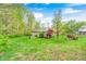 Green backyard featuring mature trees, landscaping and lawn at 8329 S Christian Dr, Nineveh, IN 46164